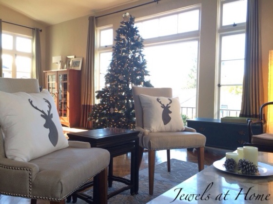 Holiday decorating.  Living room with new polar bear, snowy forest, and reindeer pillows for Christmas and the whole winter | Jewels at Home